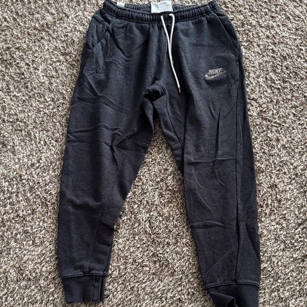 Nike Black Sweatpants with Tapered Ankles and Elastic Waistband